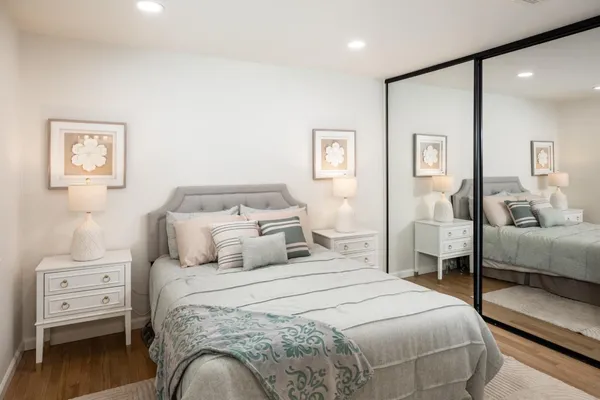 a bedroom with a bed and a couch