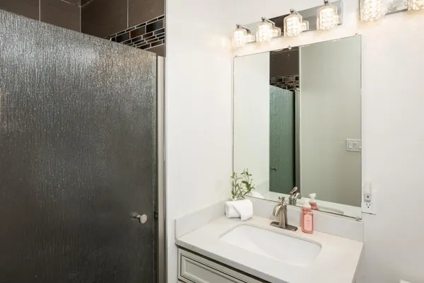a bathroom with a sink and a mirror