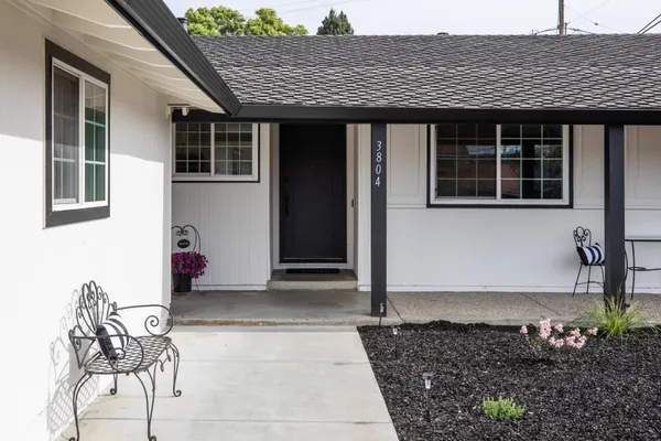 a front view of a house with garden