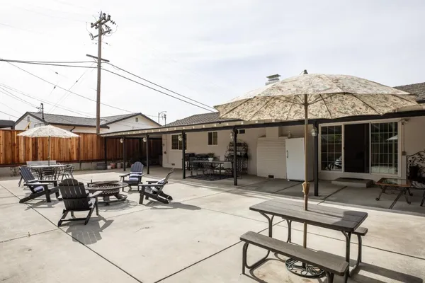 a view of a dinning table and chairs in the patio