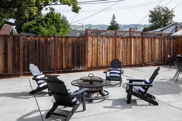 a view of a patio with couple of chairs