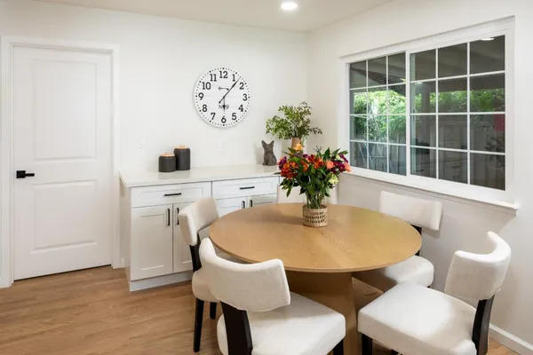 a dining room with furniture and window