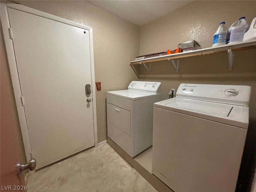 3500 Redwood Ridge Way North Las Vegas, NV 89031 - Photo 7 of 13 A dedicated utility space with essential laundry appliances for daily convenience.