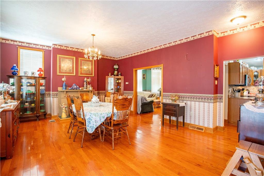 166 Pennsylvania Avenue Rochester, PA 15074 - Photo 3 of 30 a view of a dining room with furniture window and wooden floor