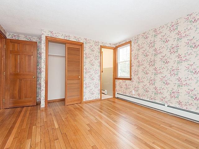 16 Tuckernuck Road Centerville, MA 02632 - Photo 11 of 26 an empty room with wooden floor and windows