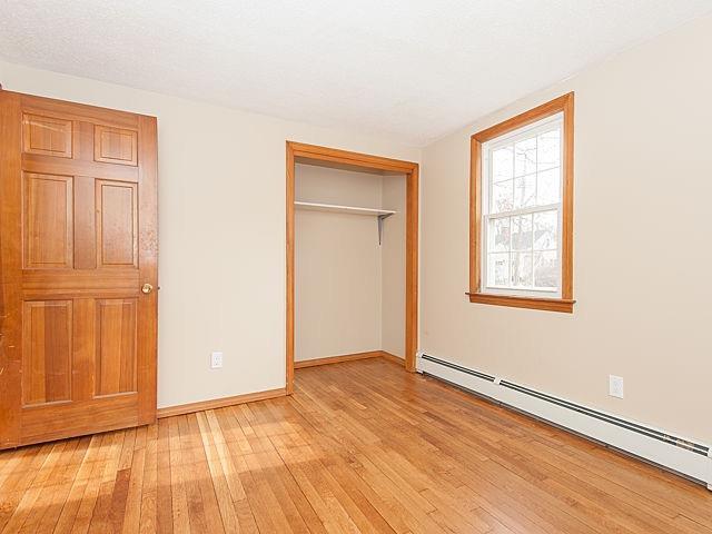 16 Tuckernuck Road Centerville, MA 02632 - Photo 12 of 26 an empty room with wooden floor closet and windows