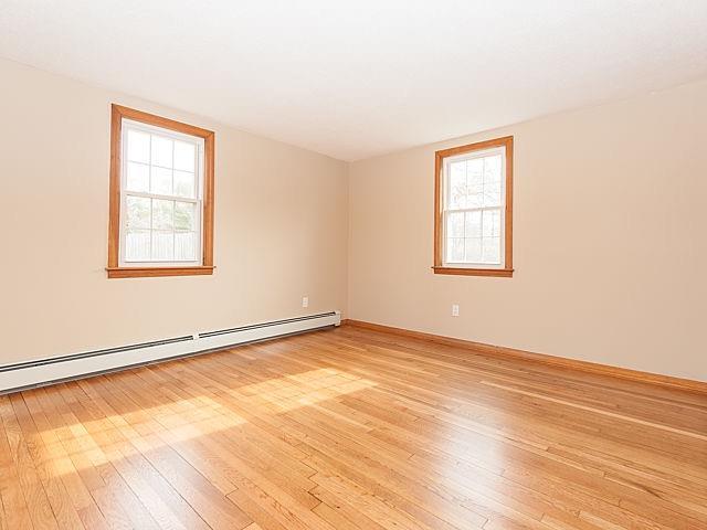 16 Tuckernuck Road Centerville, MA 02632 - Photo 13 of 26 an empty room with wooden floor and windows