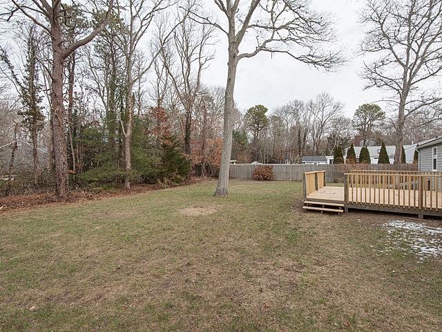 16 Tuckernuck Road Centerville, MA 02632 - Photo 22 of 26 a view of a yard with large trees