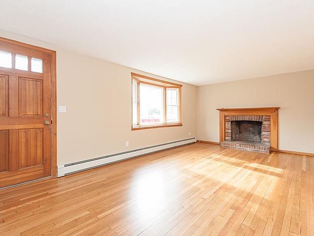 16 Tuckernuck Road Centerville, MA 02632 - Photo 3 of 26 an empty room with windows and fireplace