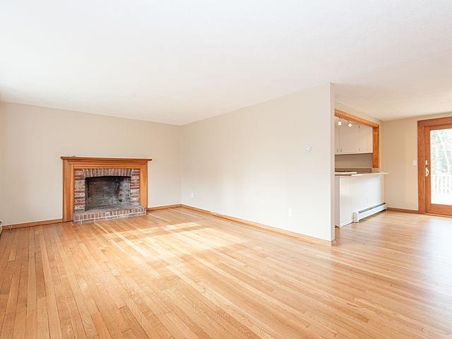 16 Tuckernuck Road Centerville, MA 02632 - Photo 4 of 26 a view of empty room with wooden floor and fireplace