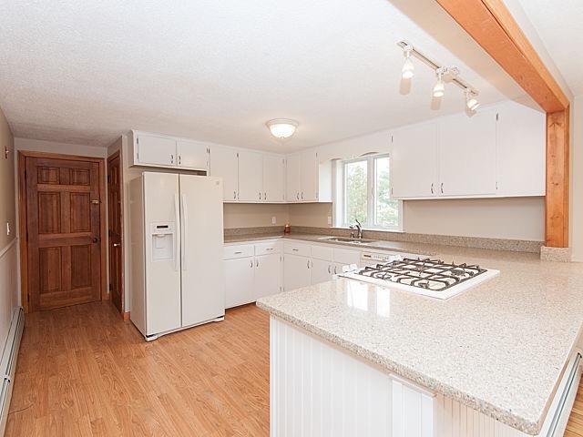 16 Tuckernuck Road Centerville, MA 02632 - Photo 6 of 26 a kitchen with stainless steel appliances granite countertop a refrigerator sink and cabinets