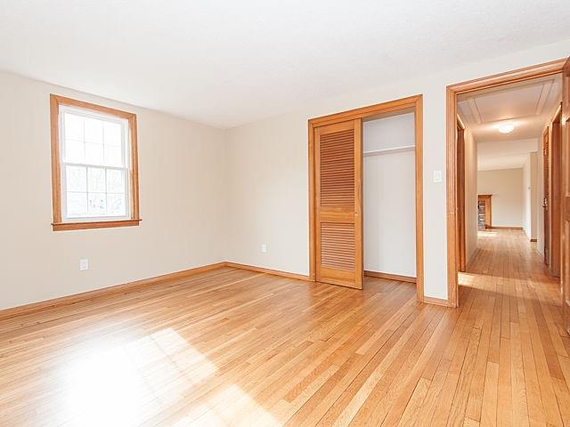 16 Tuckernuck Road Centerville, MA 02632 - Photo 10 of 26 an empty room with wooden floor and windows