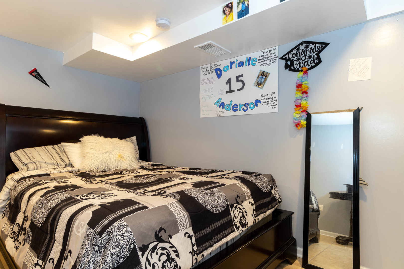 9951 South Perry Avenue Chicago, IL 60628 - Photo 25 of 27 a bedroom with a bed and painting on the wall