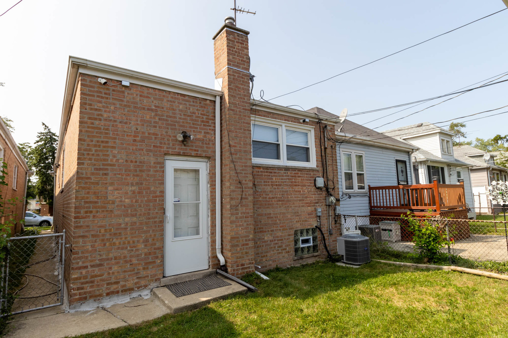 9951 South Perry Avenue Chicago, IL 60628 - Photo 4 of 27 a view of backyard with wheel chair
