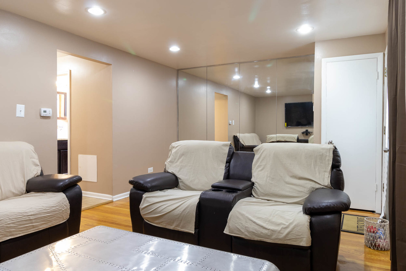 9951 South Perry Avenue Chicago, IL 60628 - Photo 6 of 27 a living room with furniture and a flat screen tv