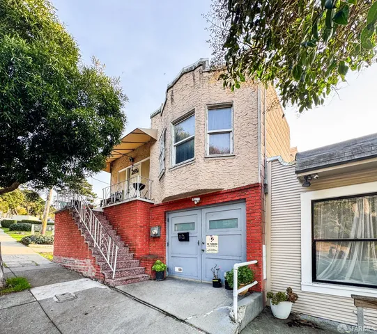 a front view of a house with garage