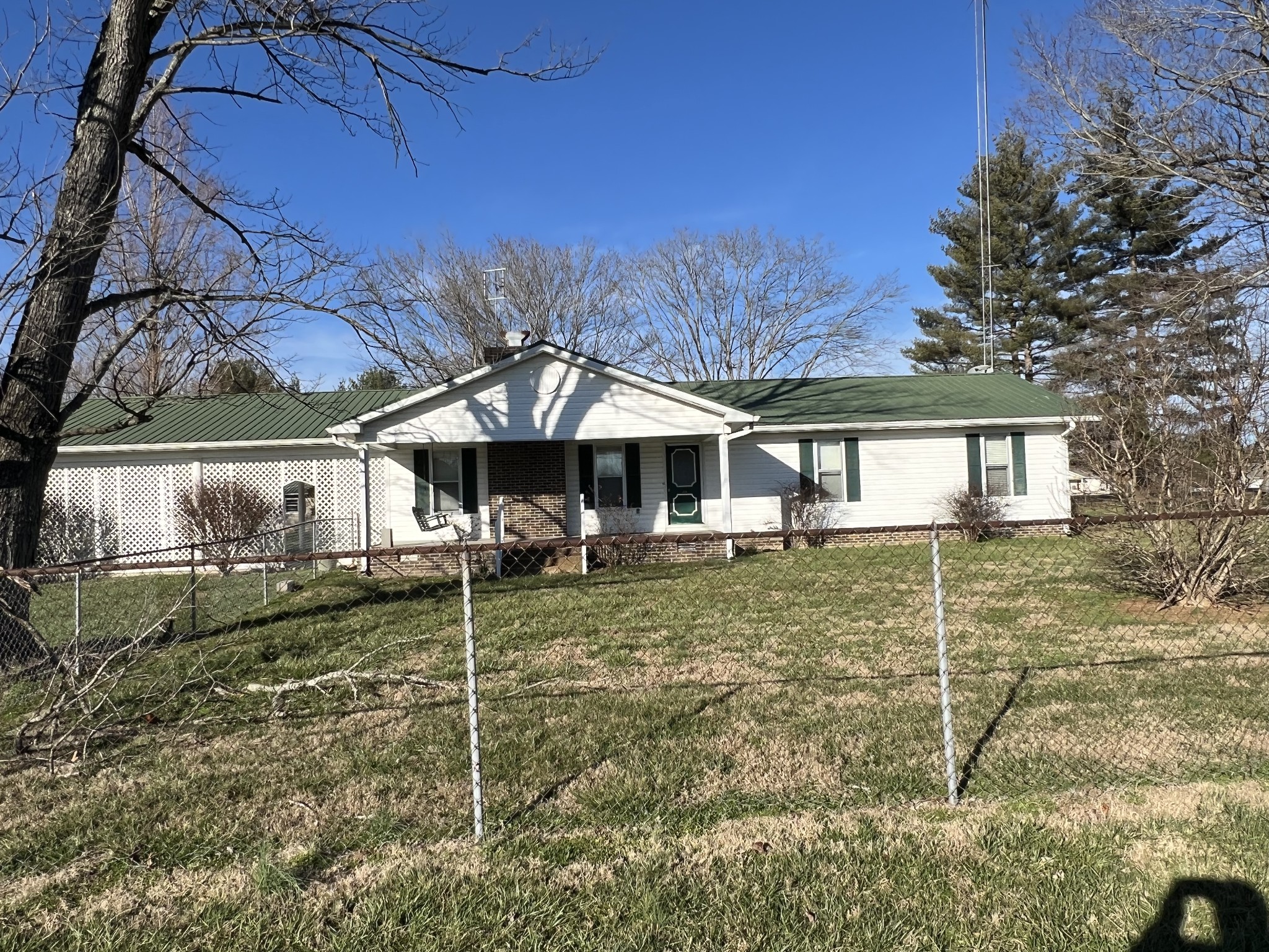 401 Hillcrest Road Manchester, TN 37355 - Photo 1 of 16 a backyard of a house with table and chairs