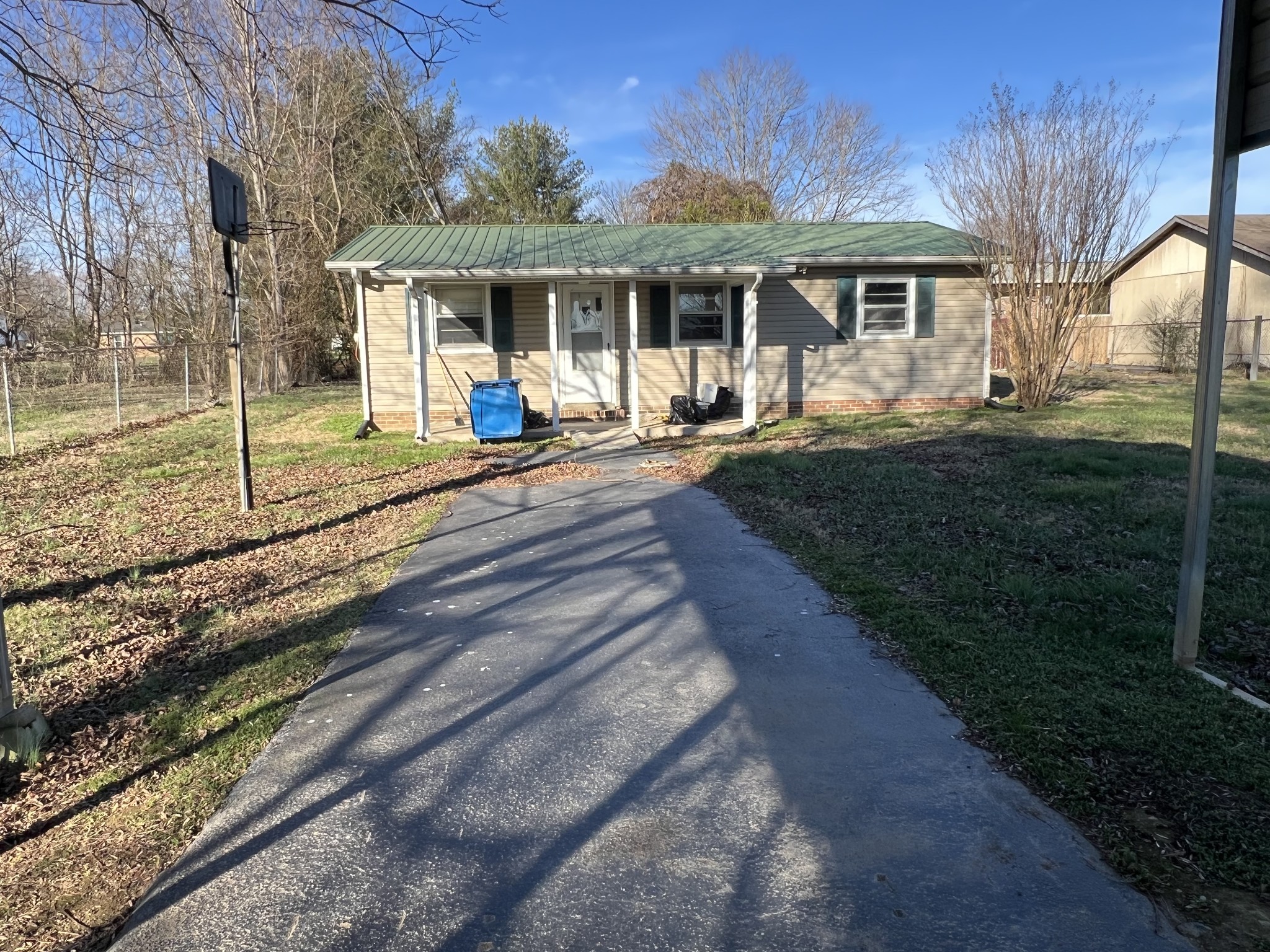 401 Hillcrest Road Manchester, TN 37355 - Photo 11 of 16 a front view of a house with a yard table and chairs