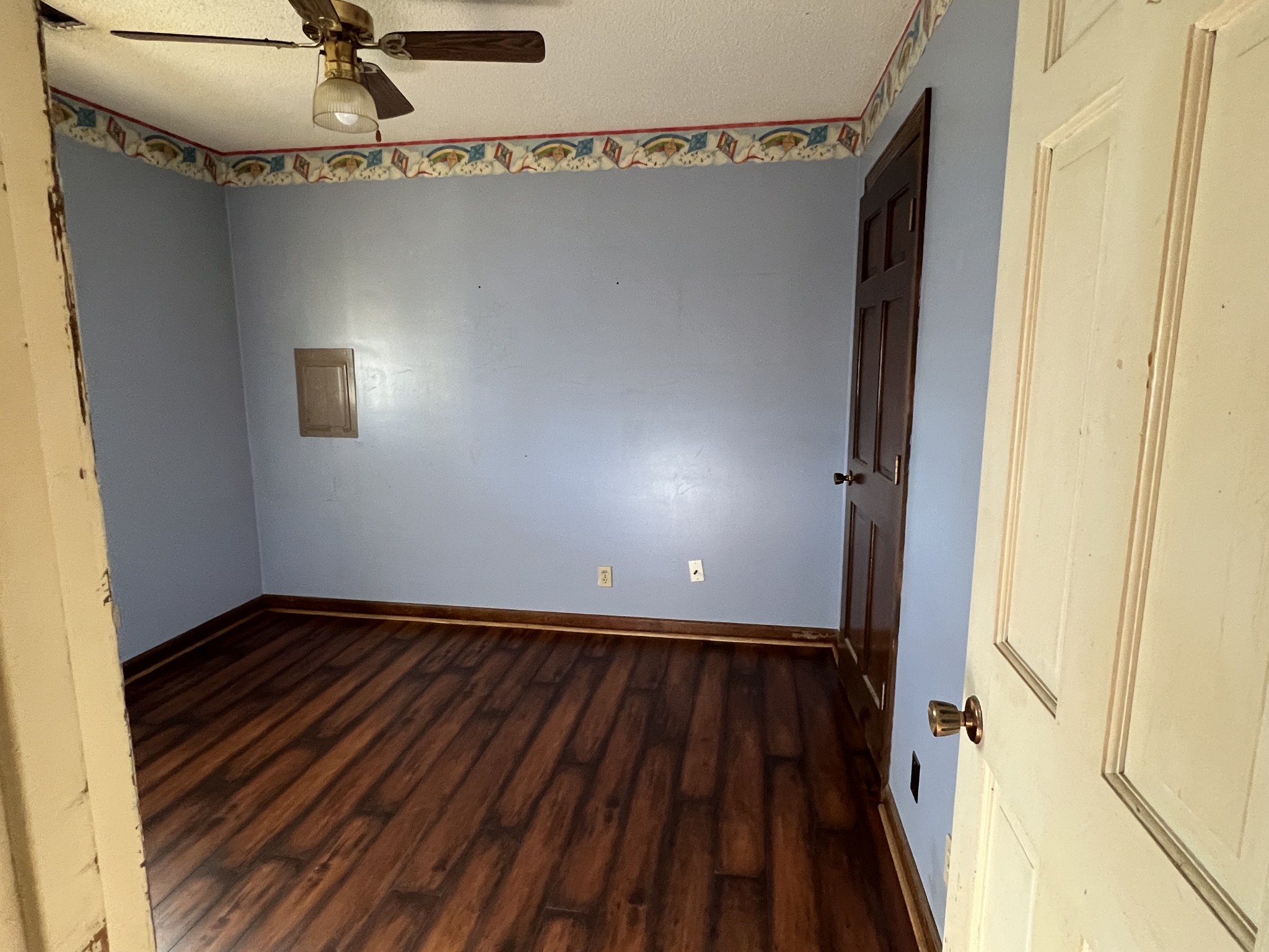 401 Hillcrest Road Manchester, TN 37355 - Photo 16 of 16 a view of a hallway with wooden floor and staircase