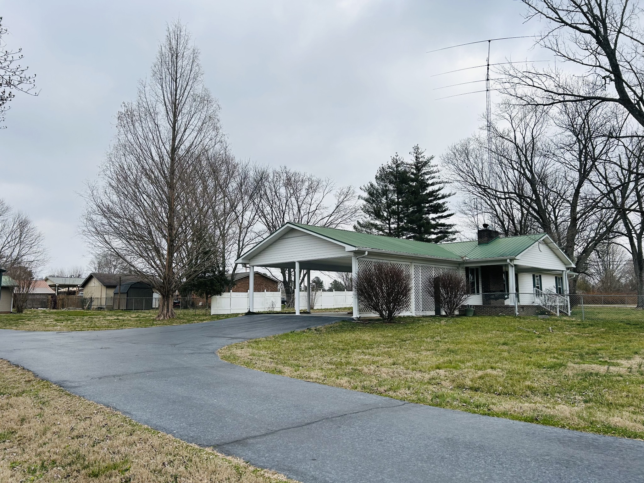 401 Hillcrest Road Manchester, TN 37355 - Photo 2 of 39 a view of a house with a yard and large tree