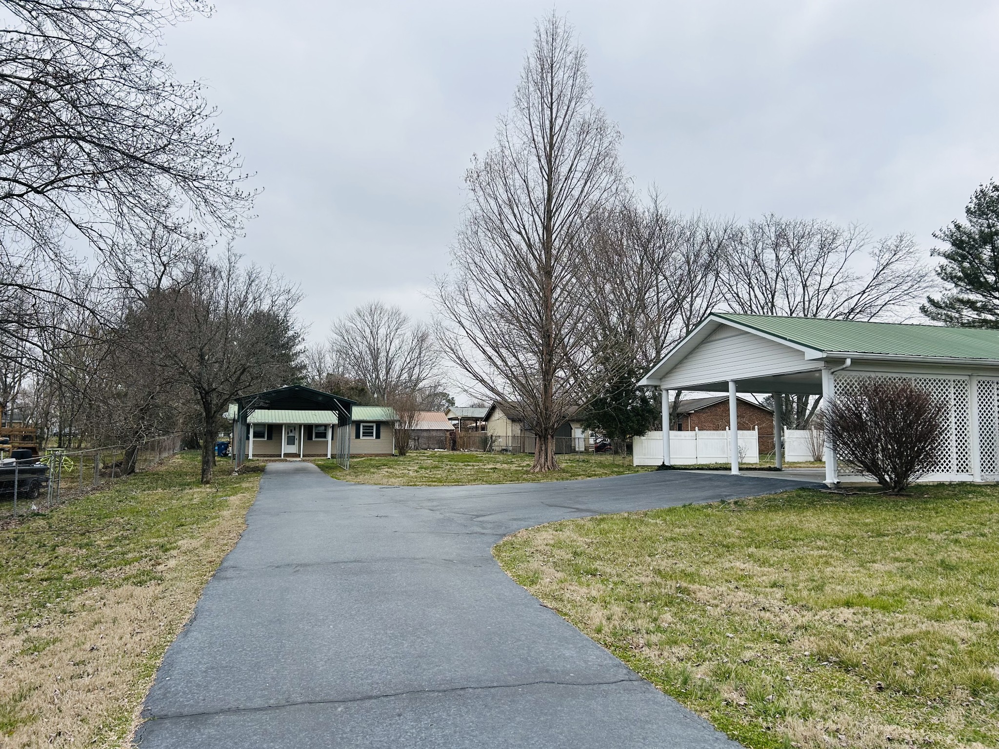 401 Hillcrest Road Manchester, TN 37355 - Photo 27 of 39 a view of a house with a yard and large trees