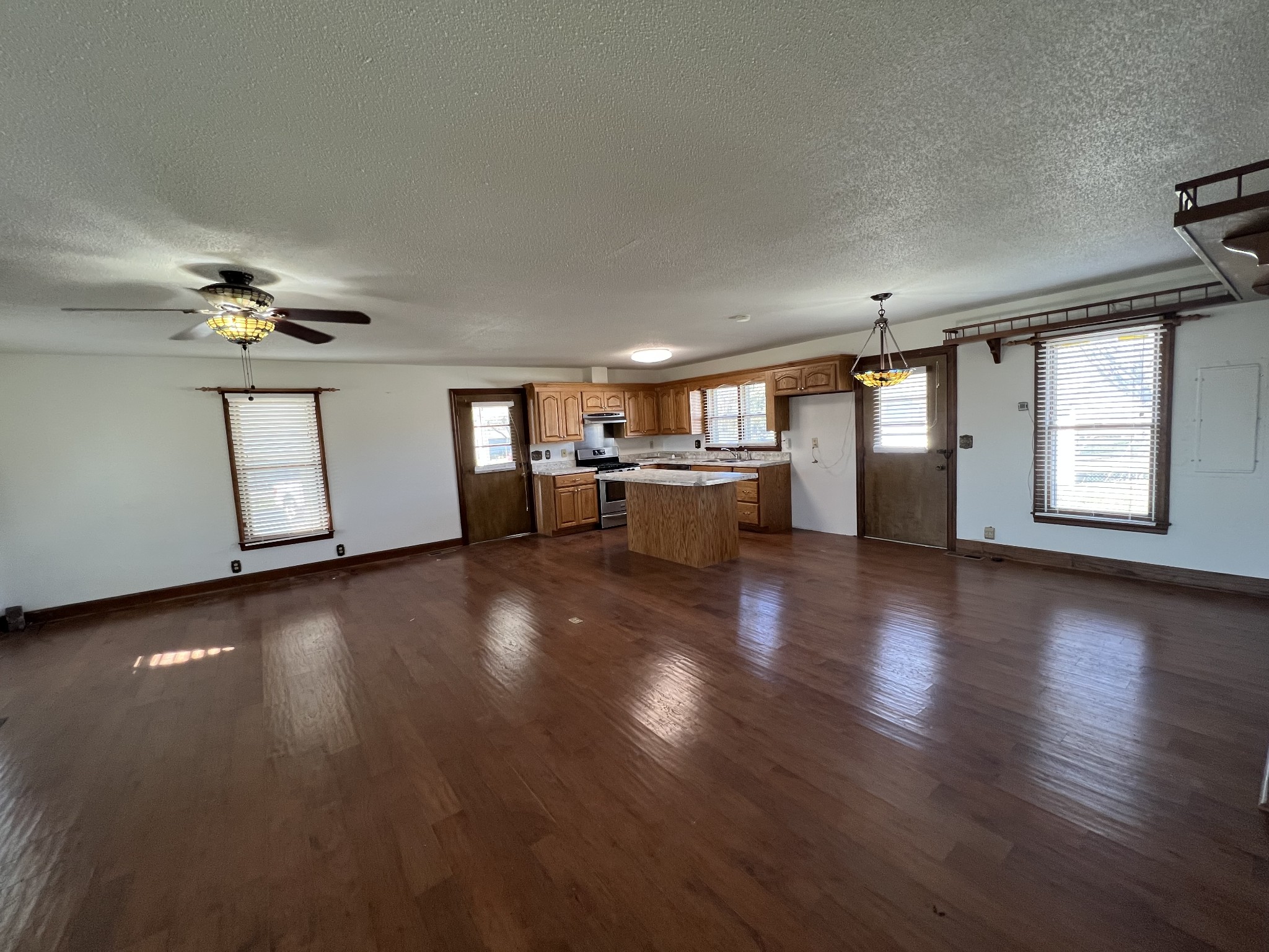 401 Hillcrest Road Manchester, TN 37355 - Photo 5 of 16 a view of a livingroom with furniture wooden floor and staircase