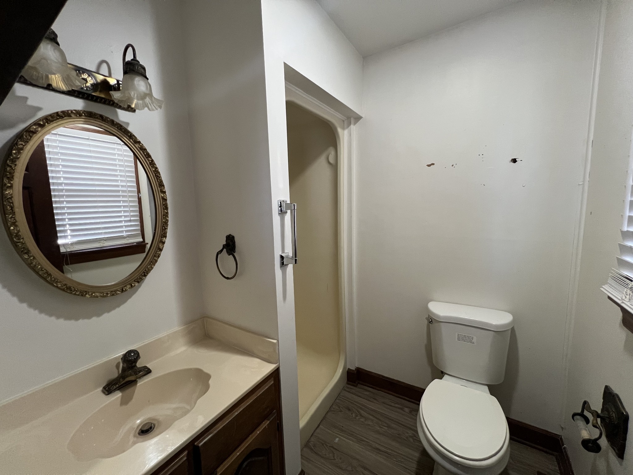401 Hillcrest Road Manchester, TN 37355 - Photo 8 of 16 a bathroom with a sink a toilet and a mirror