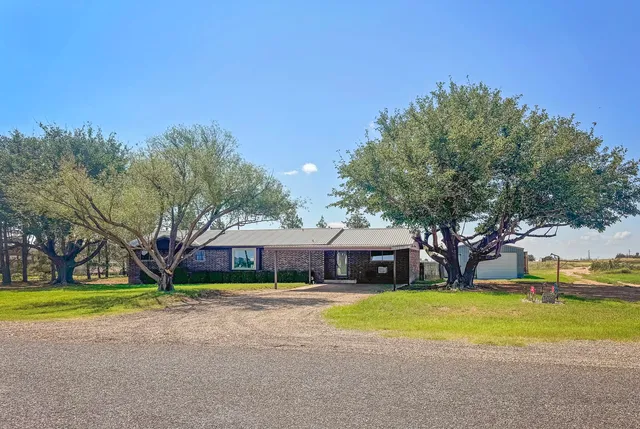 a house view with swimming pool in front of it