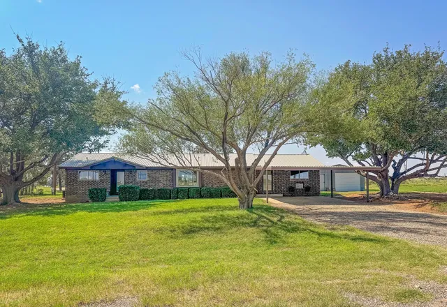 a view of a house with a big yard