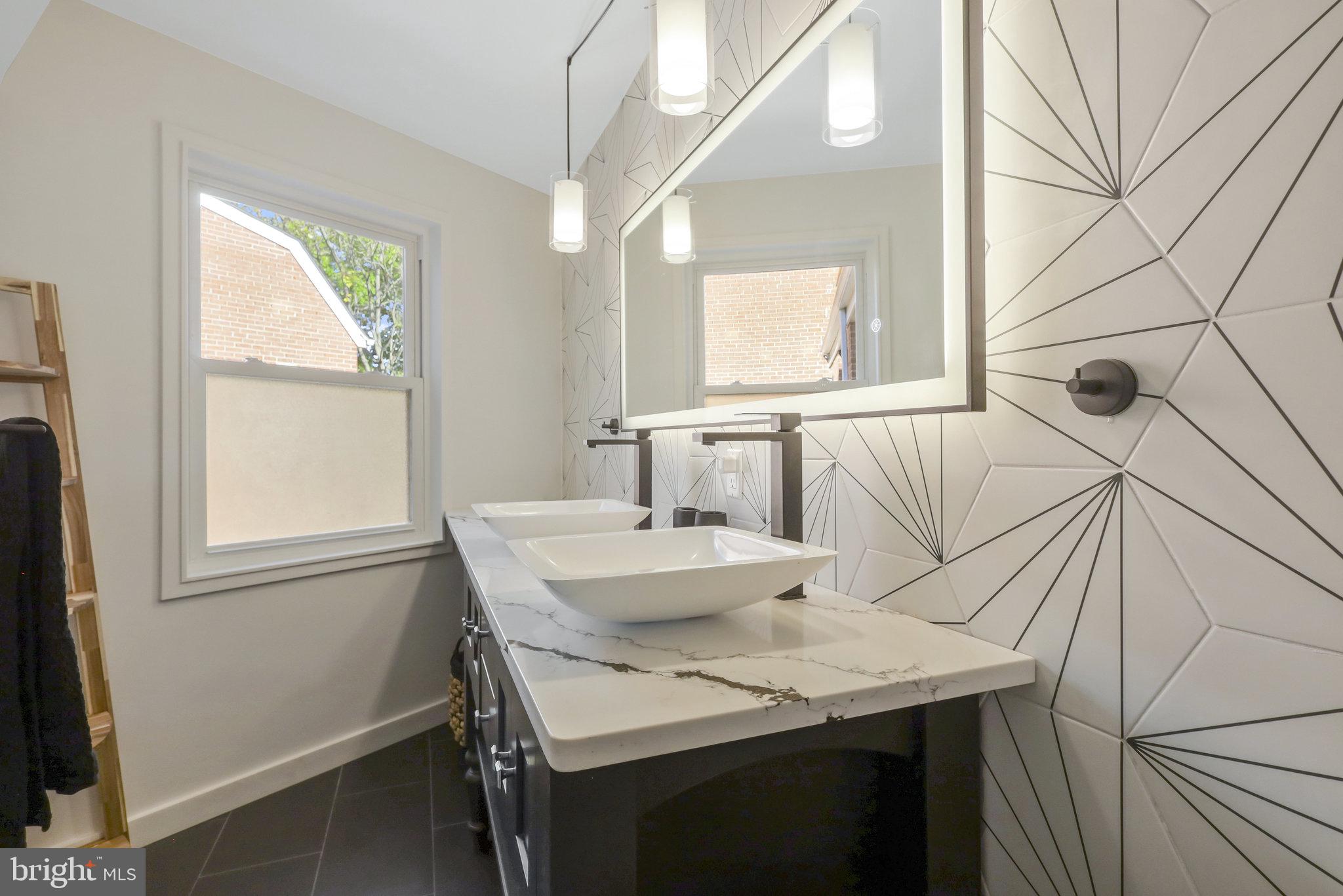116 Commerce Street Alexandria, VA 22314 - Photo 18 of 50 Sleek modern bathroom with geometric flair.