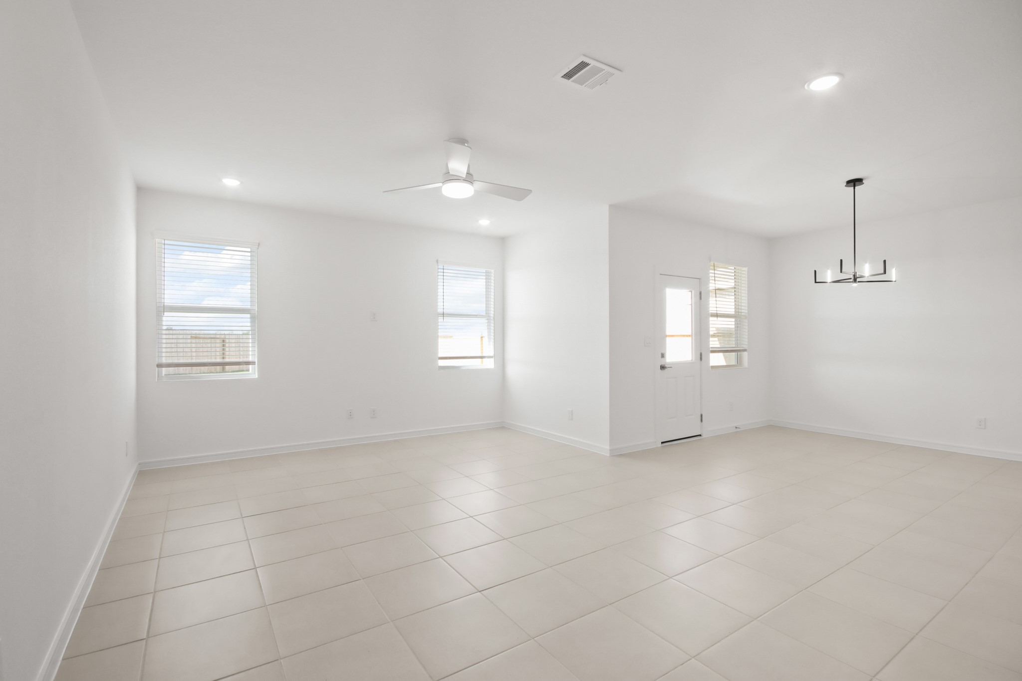 7914 Jasper Mdws Way Angleton, TX 77515 - Photo 6 of 26 an empty room with windows and entrance