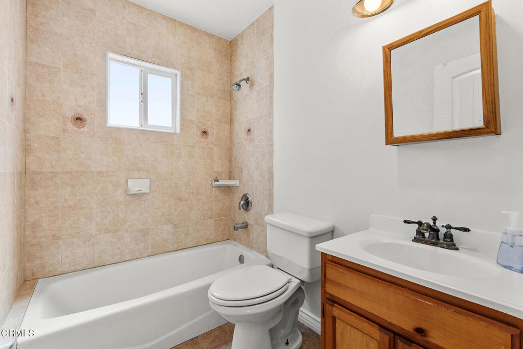 2546 Commerce Way Commerce, CA 90040 - Photo 14 of 53 a bathroom with a sink a toilet and a bathtub