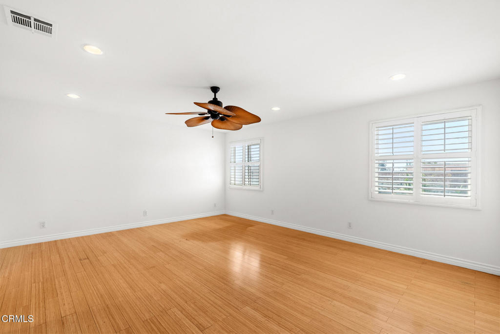 2546 Commerce Way Commerce, CA 90040 - Photo 19 of 53 an empty room with a window and a ceiling fan