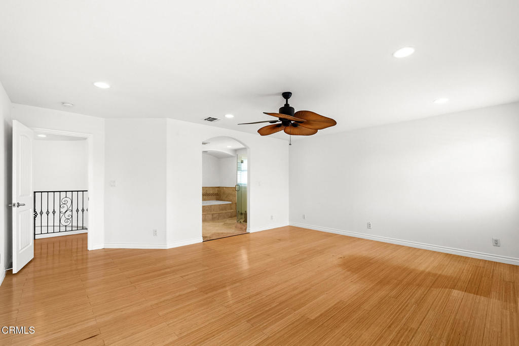 2546 Commerce Way Commerce, CA 90040 - Photo 20 of 53 a view of a room with a ceiling fan and wooden floor