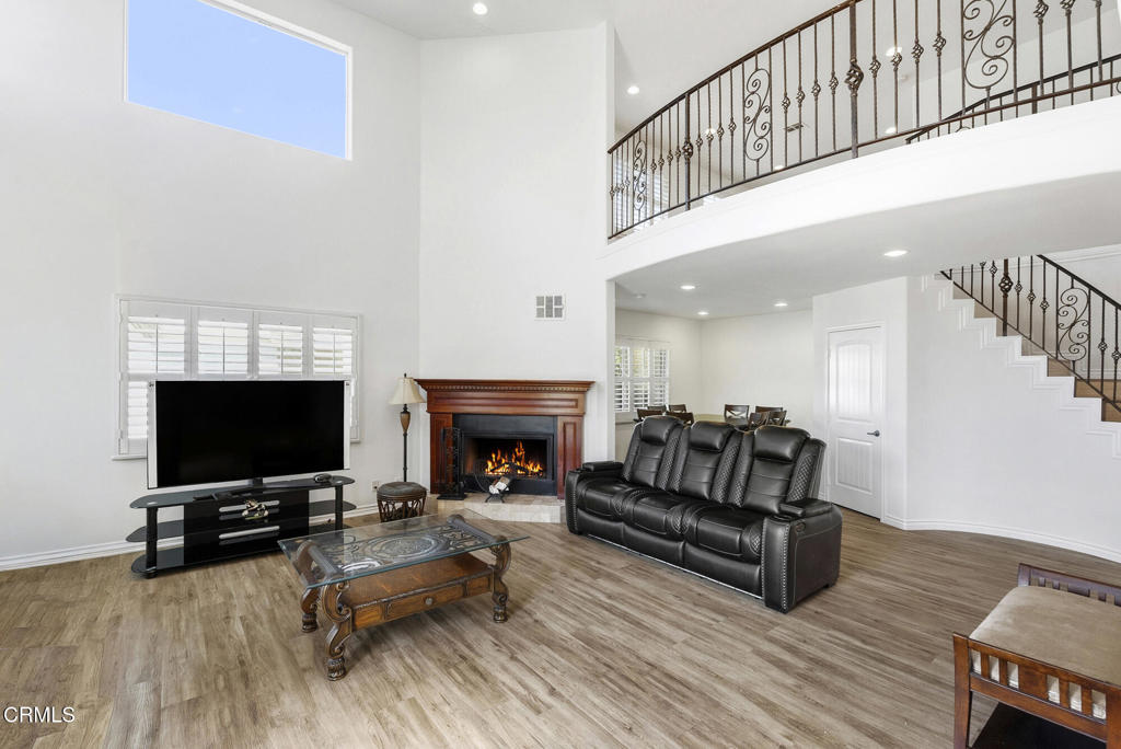 2546 Commerce Way Commerce, CA 90040 - Photo 2 of 53 a living room with furniture and a flat screen tv