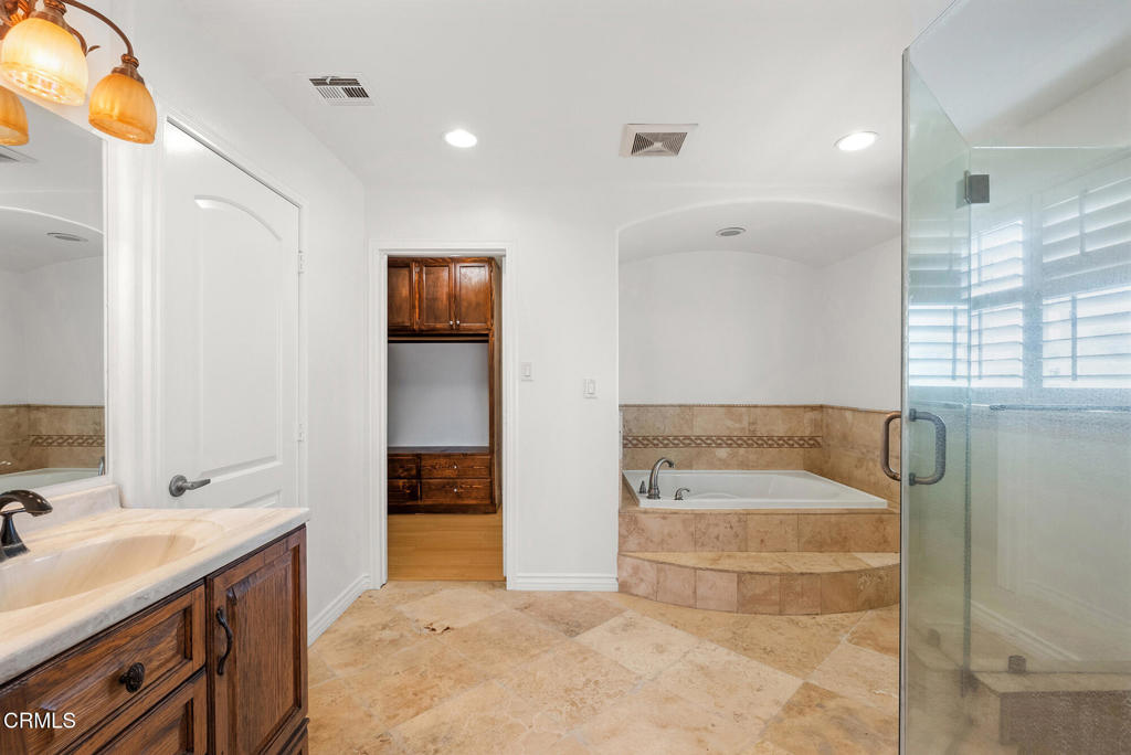 2546 Commerce Way Commerce, CA 90040 - Photo 22 of 53 a spacious bathroom with a tub sink and mirror