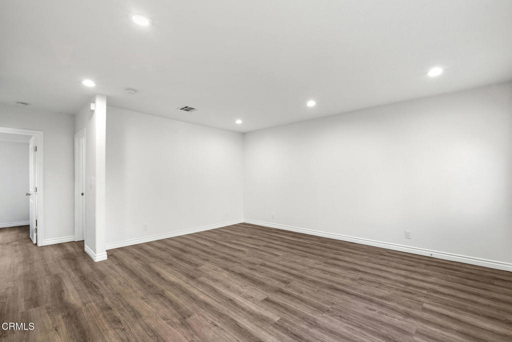 2546 Commerce Way Commerce, CA 90040 - Photo 34 of 53 a view of room with wooden floor and white walls
