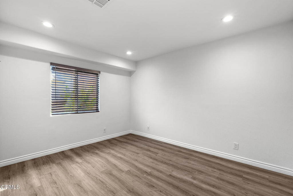 2546 Commerce Way Commerce, CA 90040 - Photo 41 of 53 wooden floor in an empty room with a window