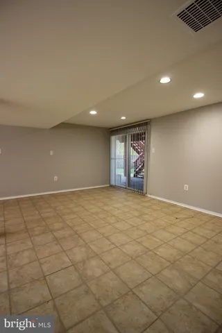 an empty room with wooden floor