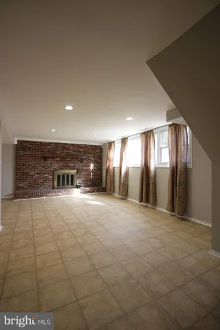 a bathroom with a sink a toilet a mirror and window