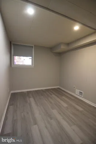 a bathroom with a toilet and a bathtub