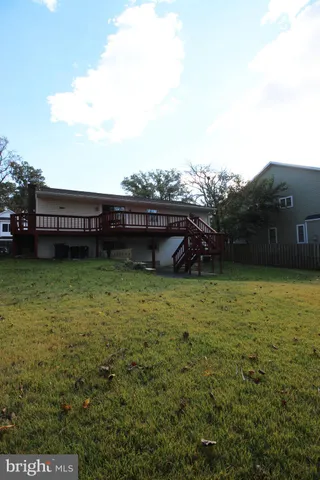 a view of a room with wooden floor and stairs