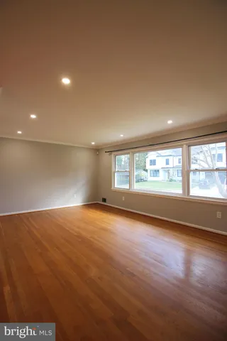 a view of a kitchen with a sink and a large window