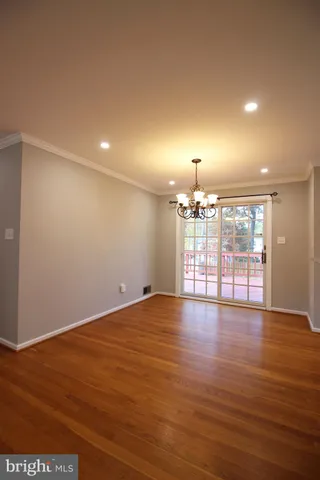 a large kitchen with a refrigerator a stove top oven a sink and dishwasher