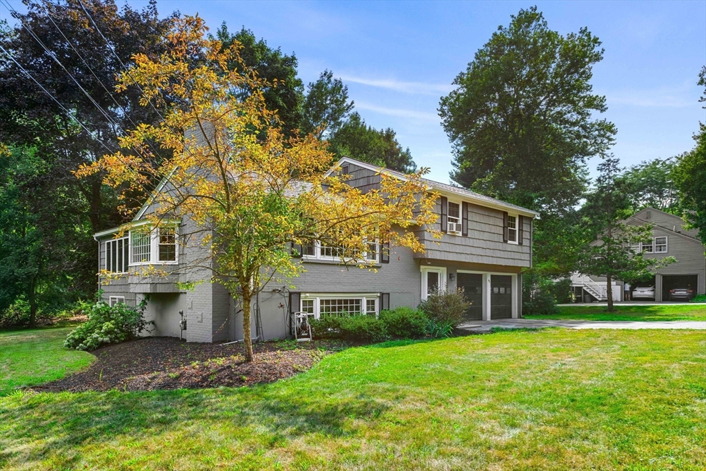 45 Wildwood Road Andover, MA 01810 - Photo 1 of 31 front view of a house with a yard