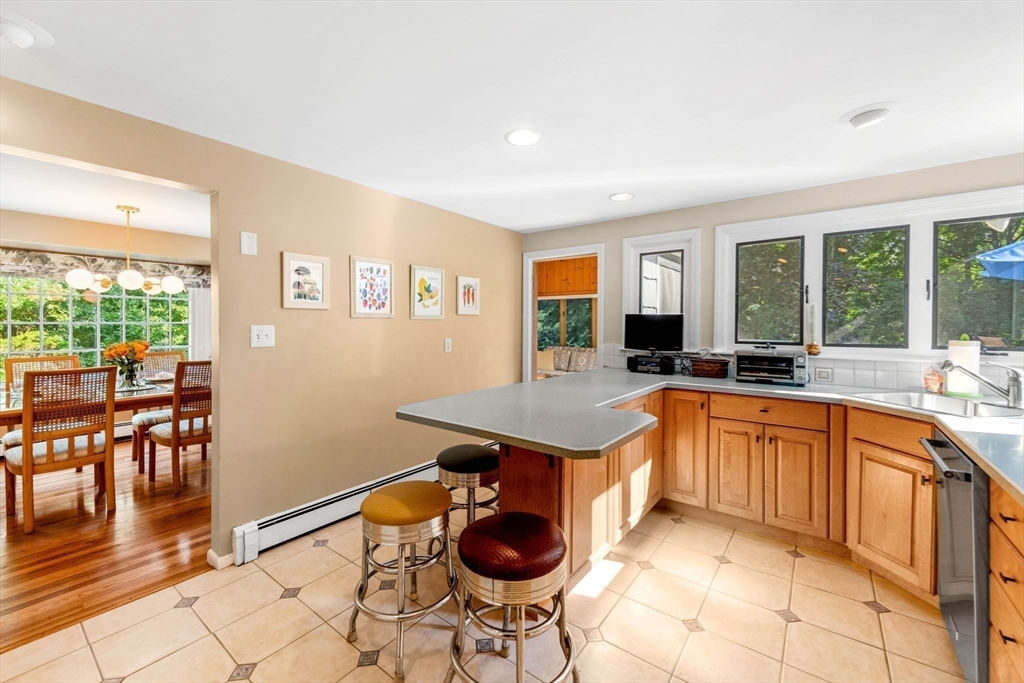 45 Wildwood Road Andover, MA 01810 - Photo 12 of 31 a kitchen with stainless steel appliances granite countertop a stove a sink and a refrigerator
