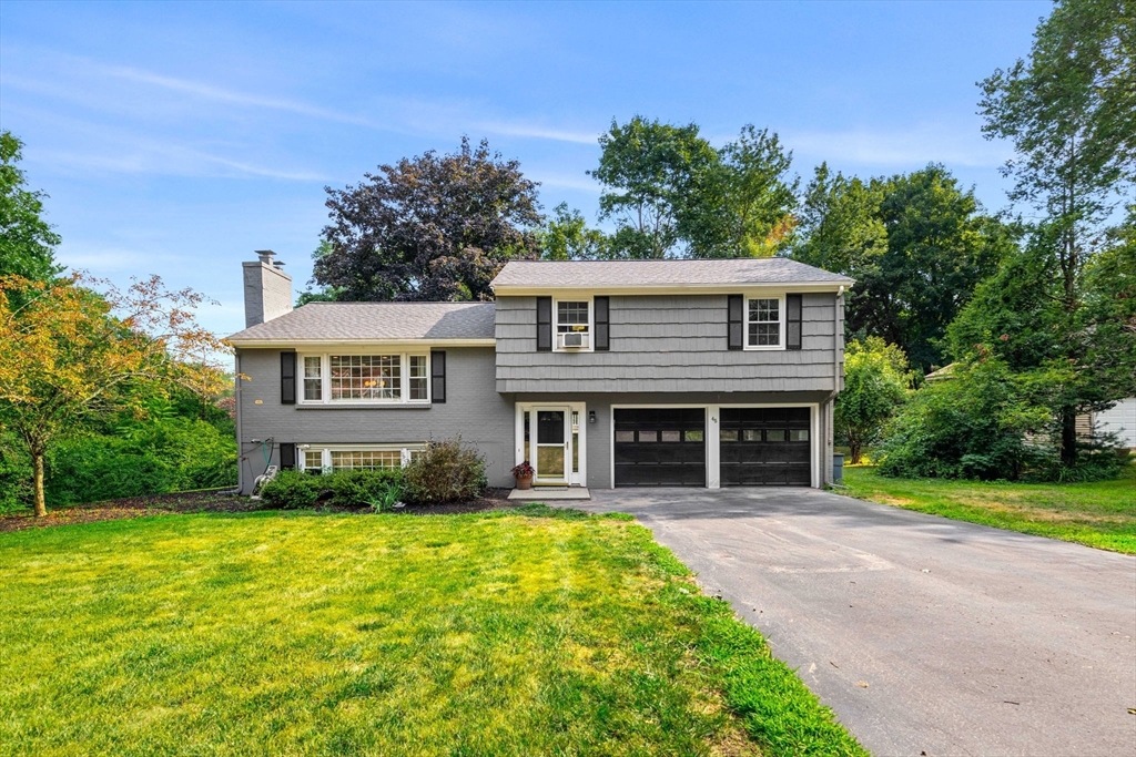 45 Wildwood Road Andover, MA 01810 - Photo 2 of 31 a front view of a house with garden