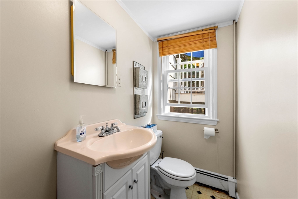 45 Wildwood Road Andover, MA 01810 - Photo 23 of 31 a bathroom with a sink a toilet and a mirror