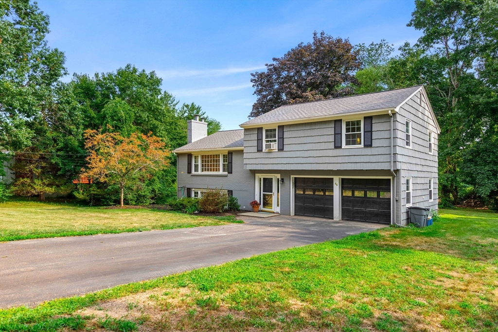 45 Wildwood Road Andover, MA 01810 - Photo 3 of 31 a view of a house with a yard and plants