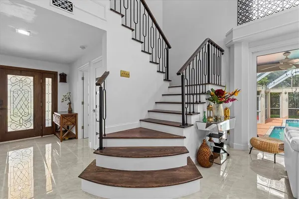 a spacious bathroom with a granite countertop tub sink a mirror a shower and a bathtub